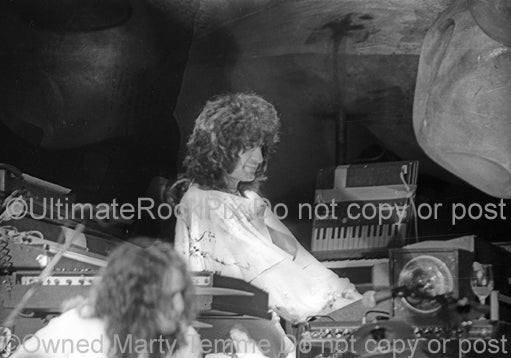 Photo of keyboardist Patrick Moraz of Yes in concert in 1975 by Marty Temme