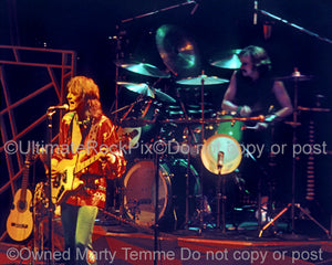 Photo of Chris Squire and Alan White of Yes in concert in 1977 by Marty Temme