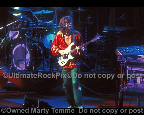 Photo of Chris Squire of Yes playing a Rickenbacker bass in 1977 by Marty Temme