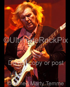 Photo of bass player Chris Squire of Yes performing in concert in 2003 by Marty Temme
