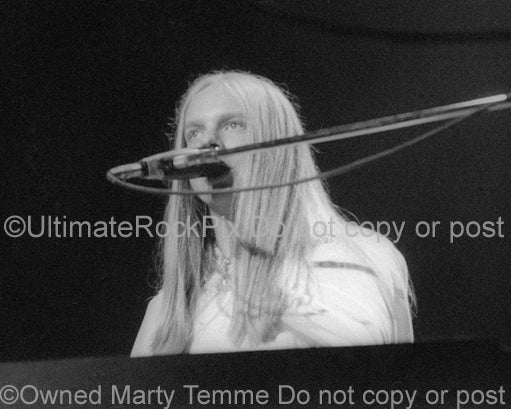 Photo of keyboard player Rick Wakeman of Yes performing onstage in 1974 by Marty Temme