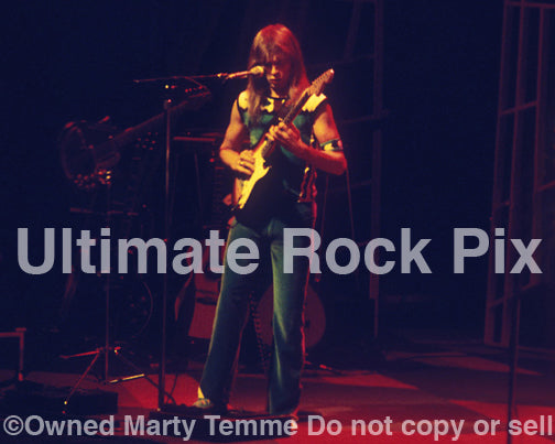 Photo of Steve Howe of Yes playing a Stratocaster in concert in 1978 by Marty Temme