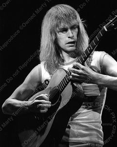 Black and white photo of Steve Howe of Yes in concert in 1978 by Marty Temme