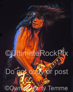 Photo of guitar player Zakk Wylde of Ozzy Osbourne playing a Gibson Les Paul in concert in 1991 by Marty Temme