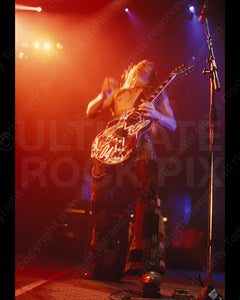 Photo of Zakk Wylde of Ozzy Osbourne playing his Les Paul in concert in 1991 by Marty Temme