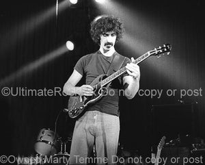 Photos of Guitarist Frank Zappa Playing a Gibson SG Special in 1973 by Marty Temme