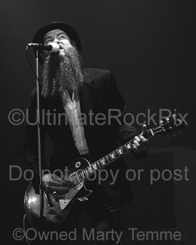 Photo of Billy Gibbons of ZZ Top playing a Gibson Les Paul onstage in 1979 by Marty Temme